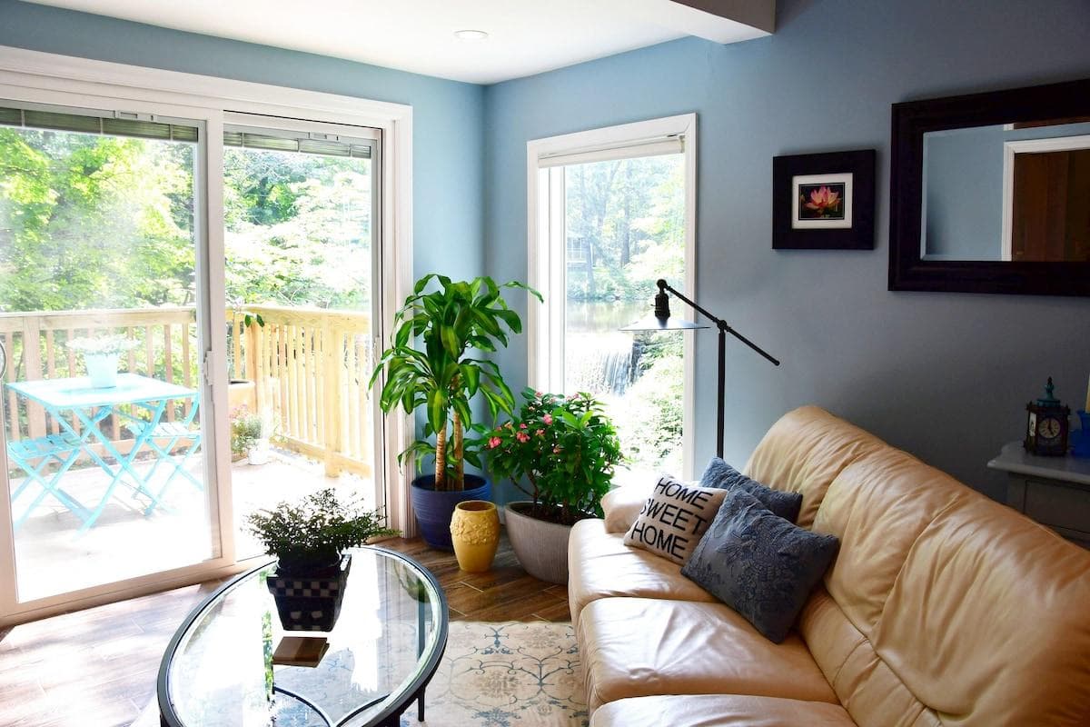 Living Room, deck and stunning view of the falls.  You'll be soothed by the sounds of rushing water!